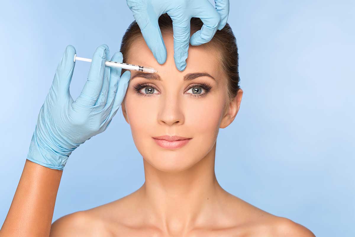 Beauty woman giving botox injections at Perfect Skin MD