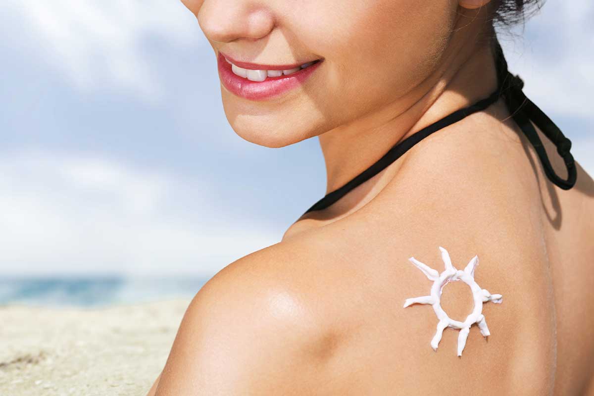Woman with Sunscreen solar cream