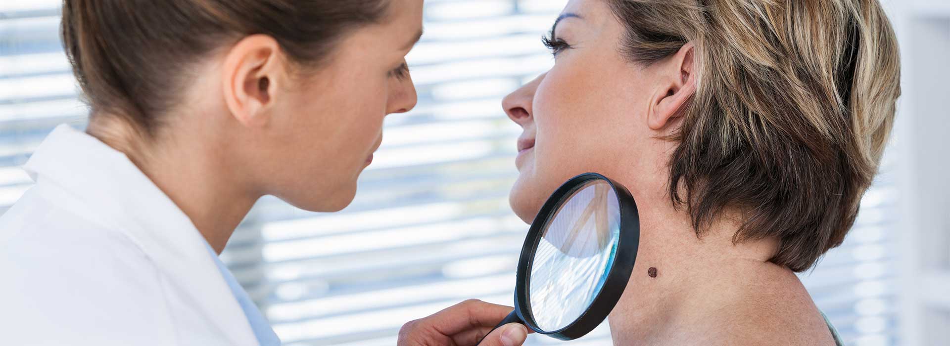 Dermatologist examining the skin cancer at Perfect Skin MD